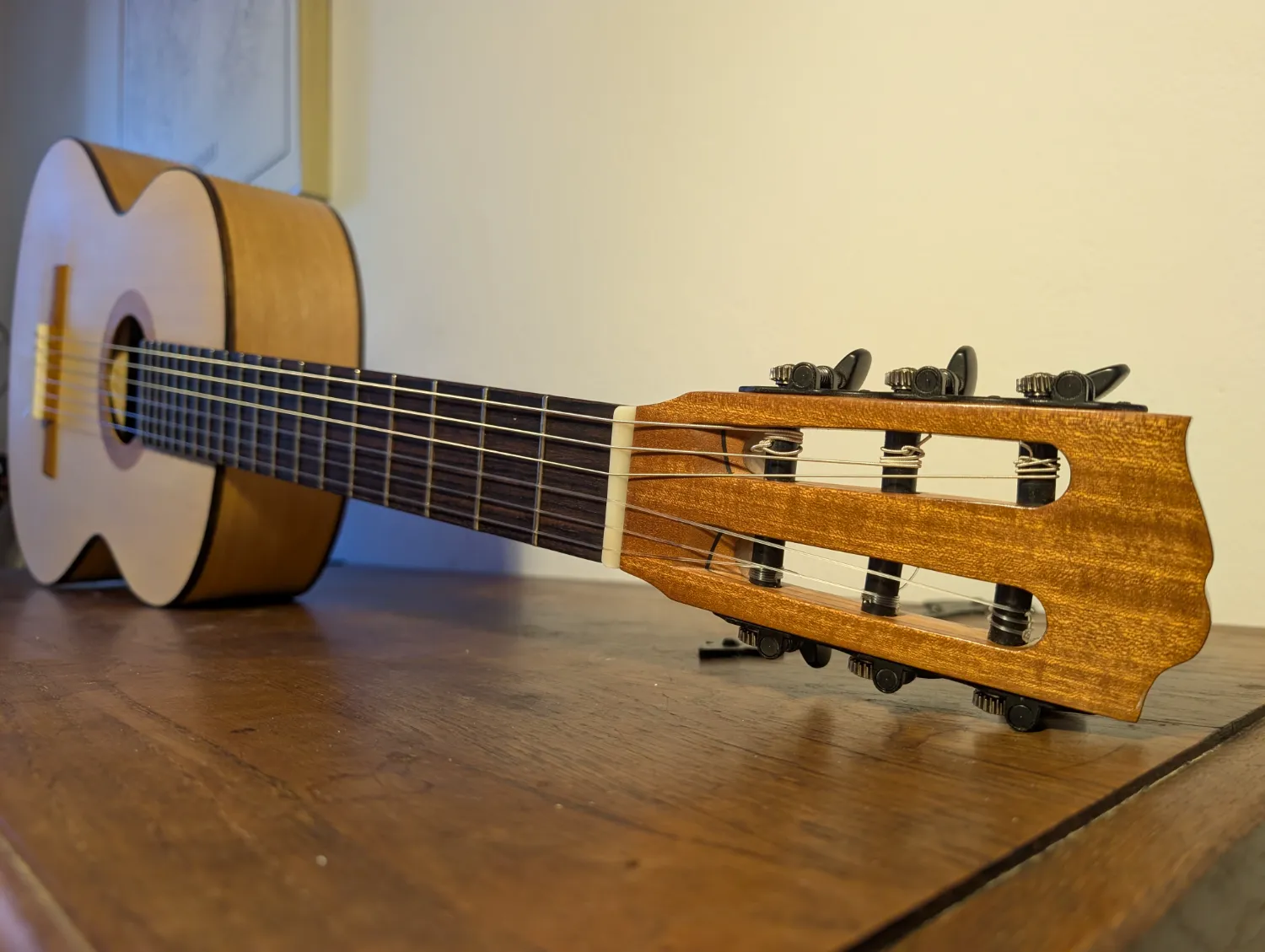 Asterion guitar lower bout and waist showing Cypress and Spruce woods